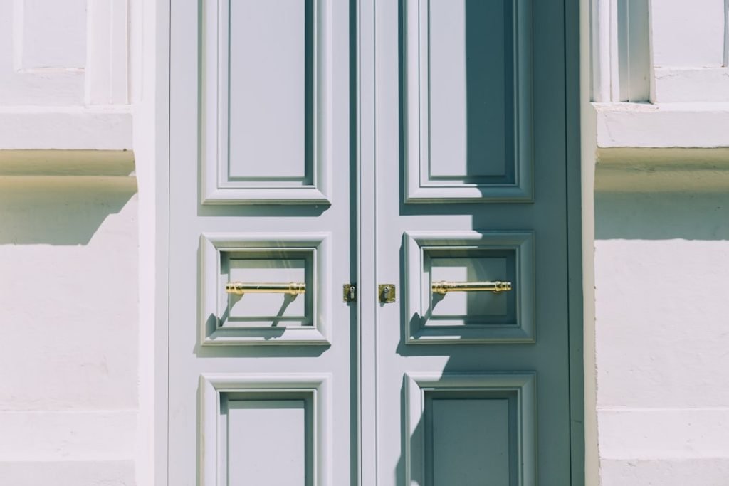 two-white-wooden-doors-zrzknnlkbu8